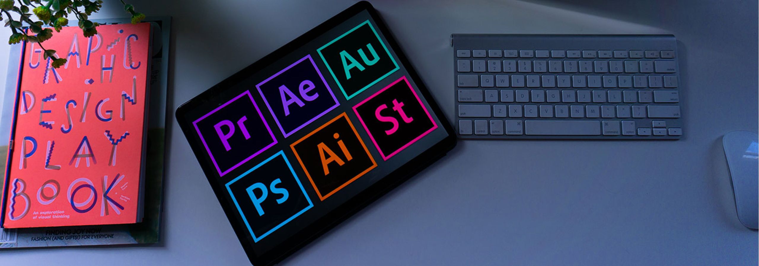 adobe logos next to a keyboard